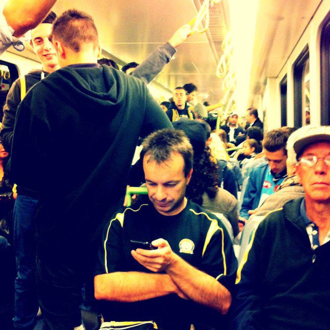 On the train headed to the footy game.