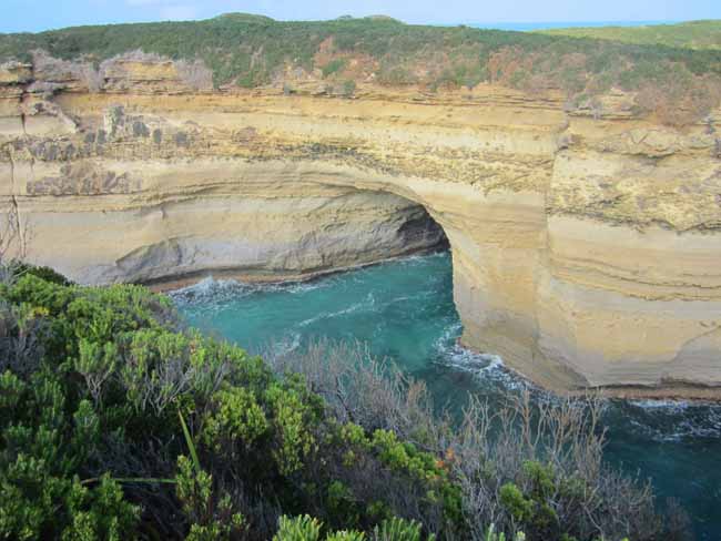 A limestone arch on the water.