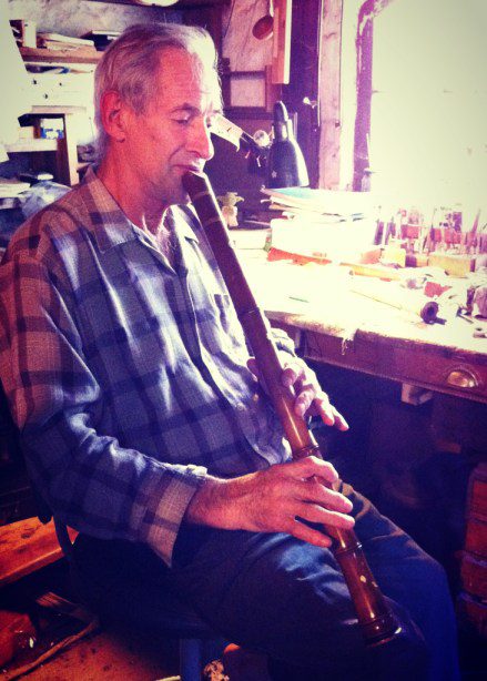 Montsalvat Artist David Brown playing a flute.