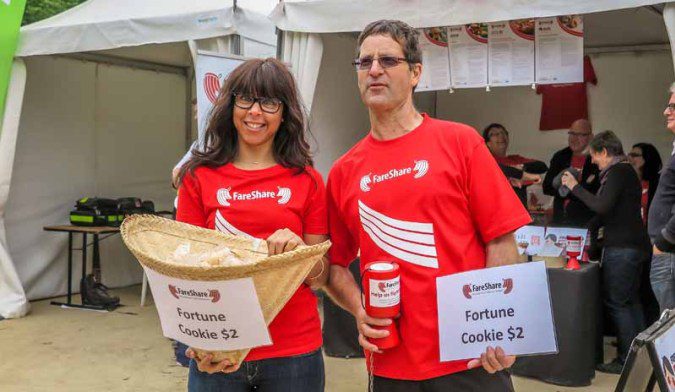 Two people collecting for charity.