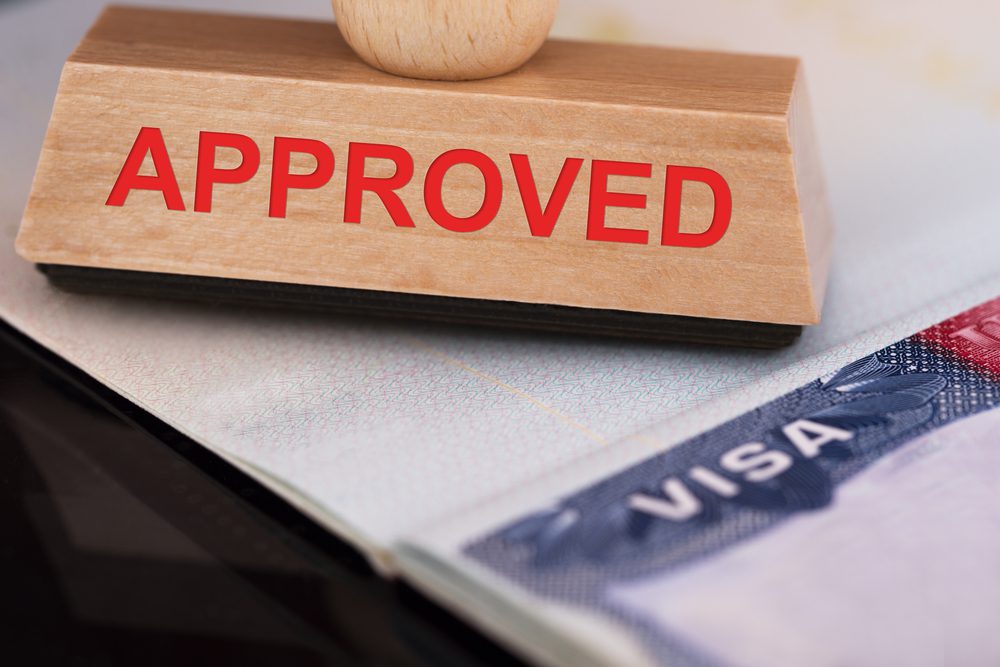 Close up of an approved stamp on a visa