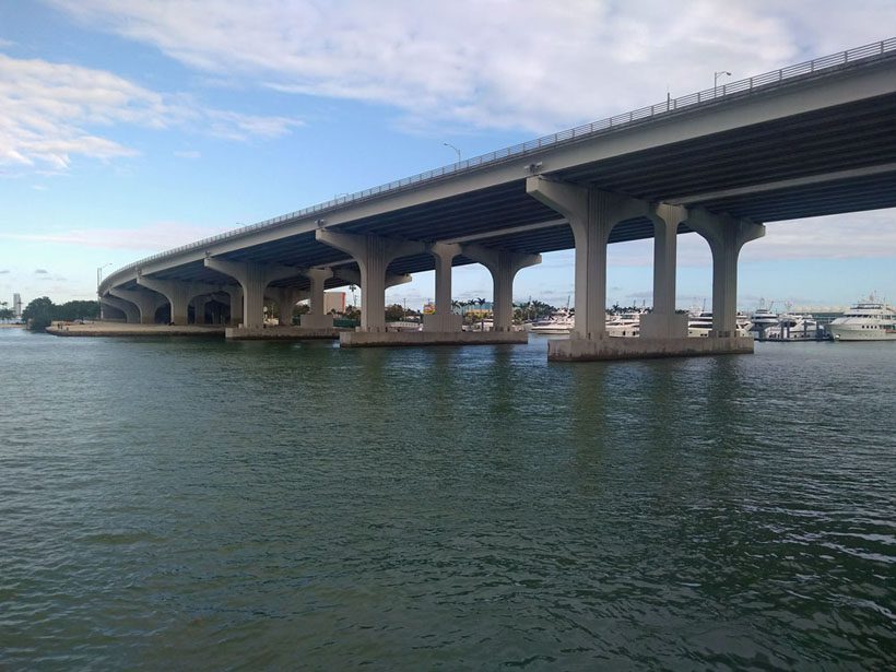 View of a bridge from the water.