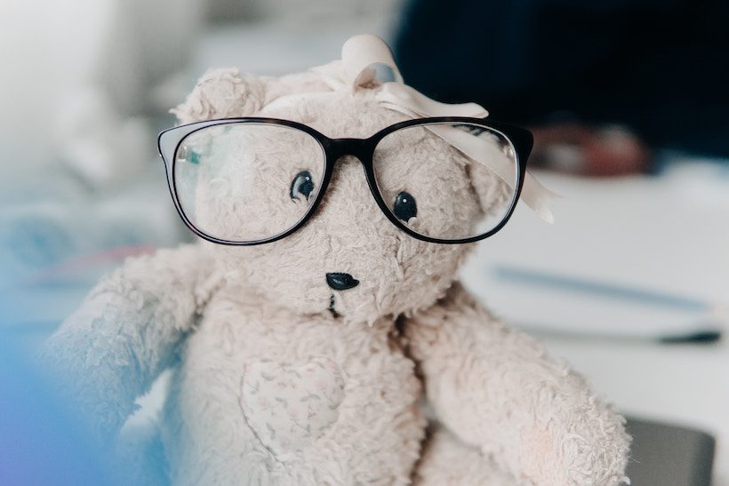 Teddy bear wearing glasses for Friday Happy Hour post.