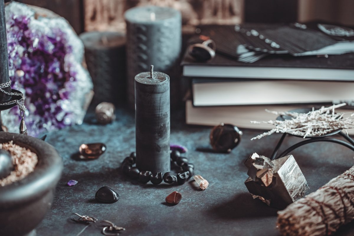 Black candle on a Witch's altar