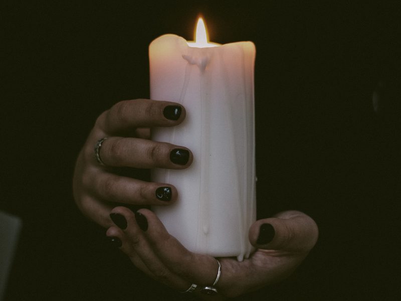 Hand holding candle