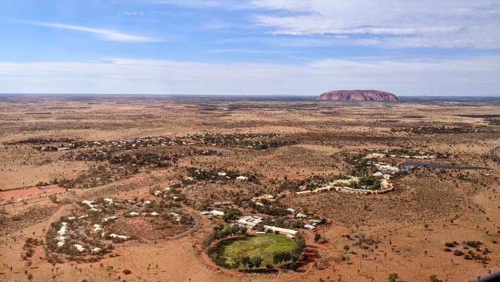 Aerial view of Ayers Rock Resort and Uluru.