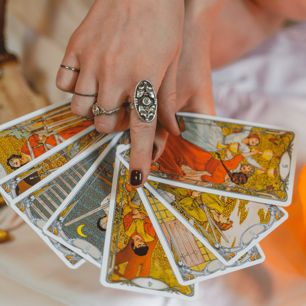 A hand with tarot hards.
