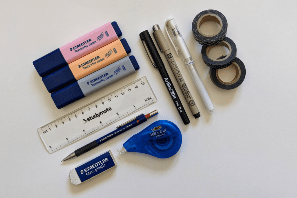 Highlighters, pens, washi tape, and other Bullet Journal accessories.