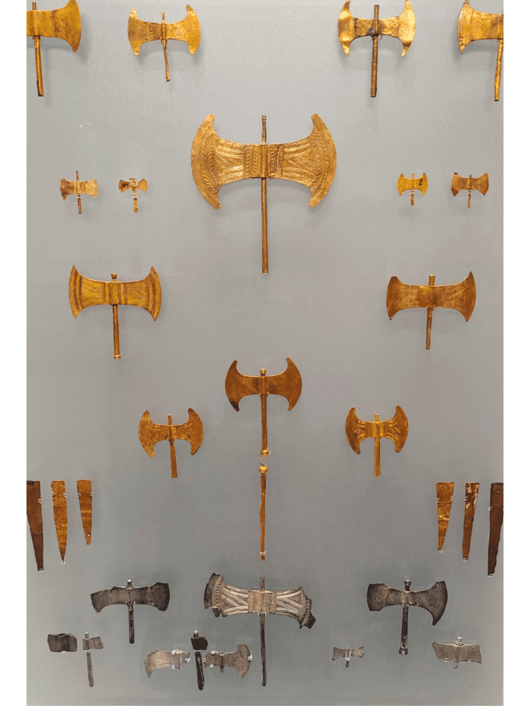 Votive double axes of gold, silver, and bronze sheet at the Heraklion Archaeological Museum.