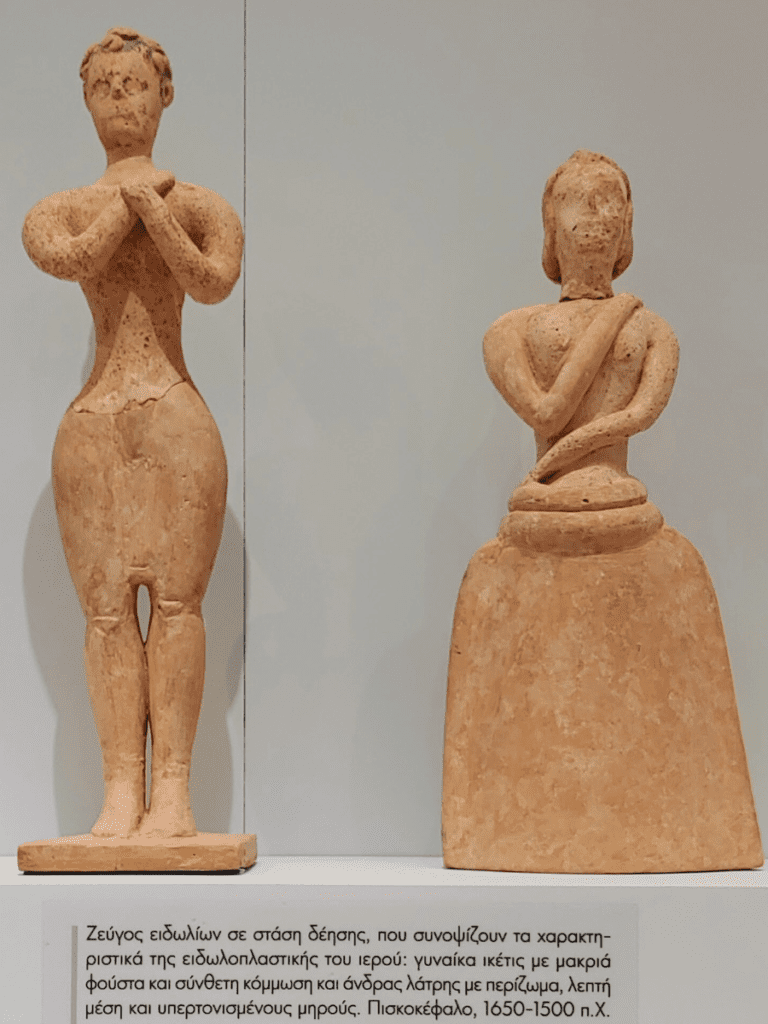 Clay male and female worshipper.