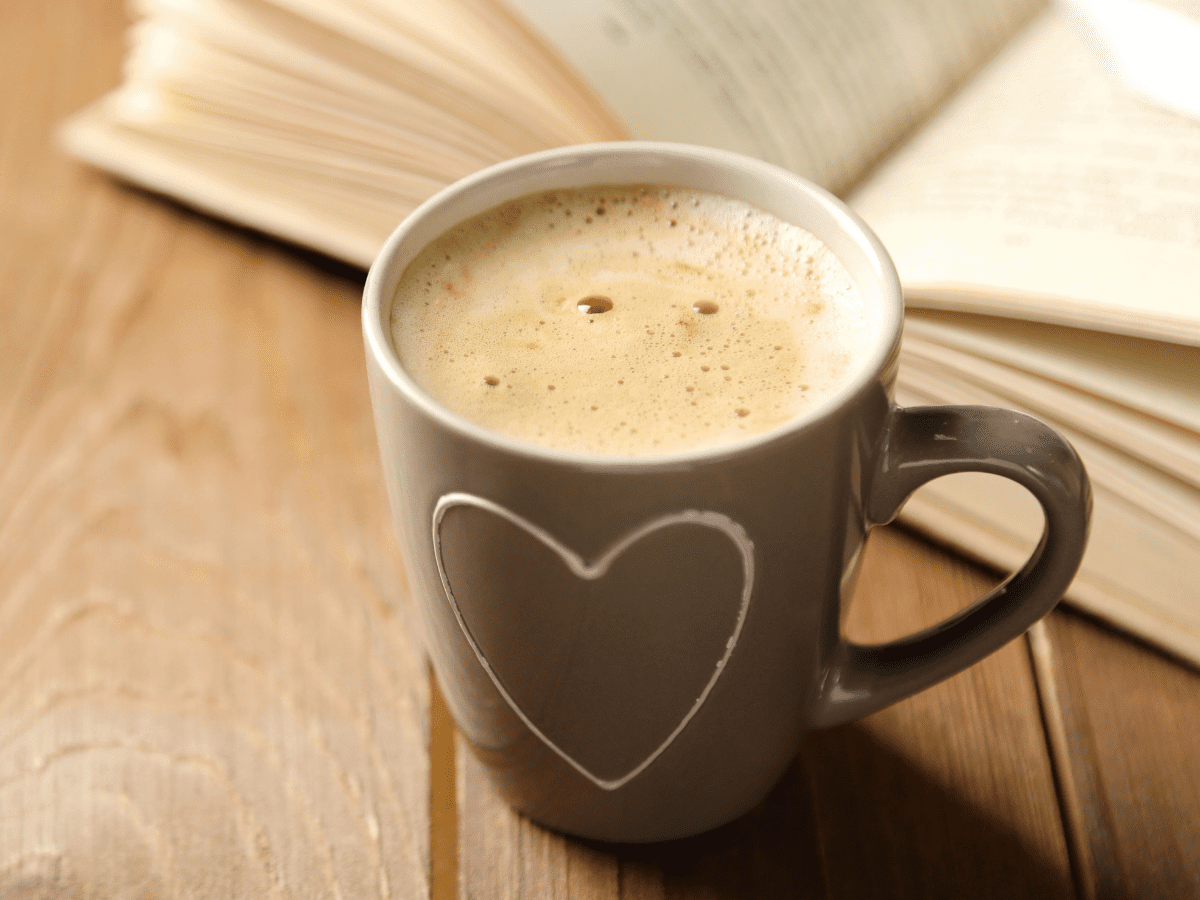 Cup of coffee and a book.
