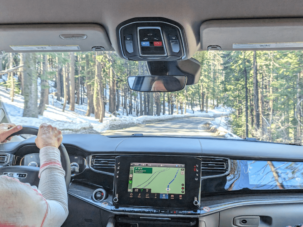 A view of the road from within the car through the dashboard.