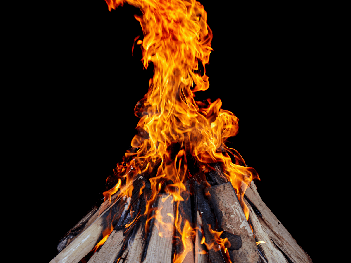 Flames rising from a bonfire.