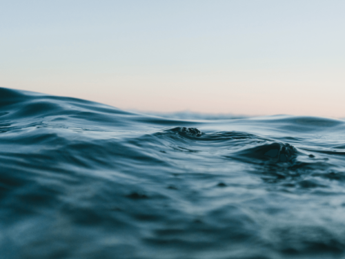 A body of water under blue skies.