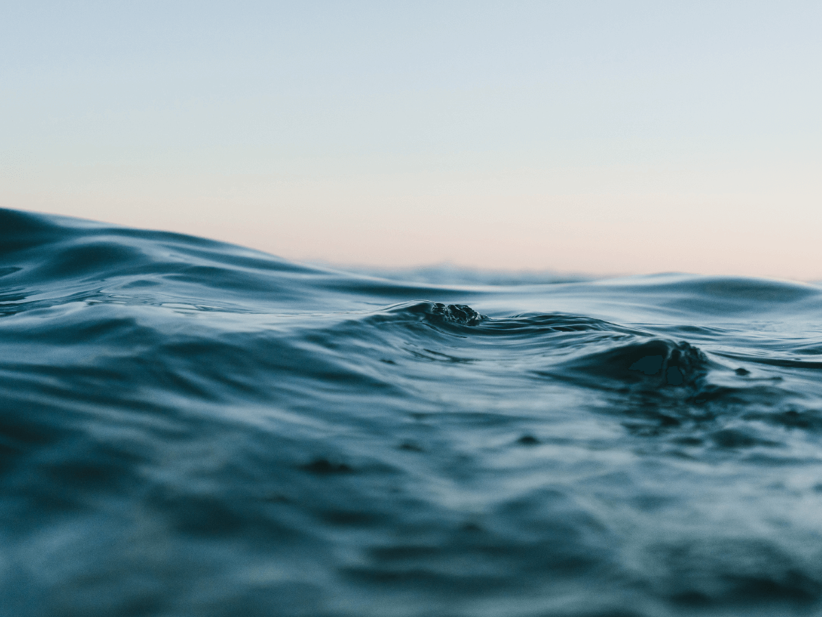 A body of water under blue skies.