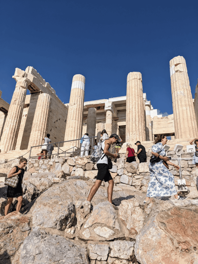 Climbing the steps up to the Propylaea of the Acropolis.