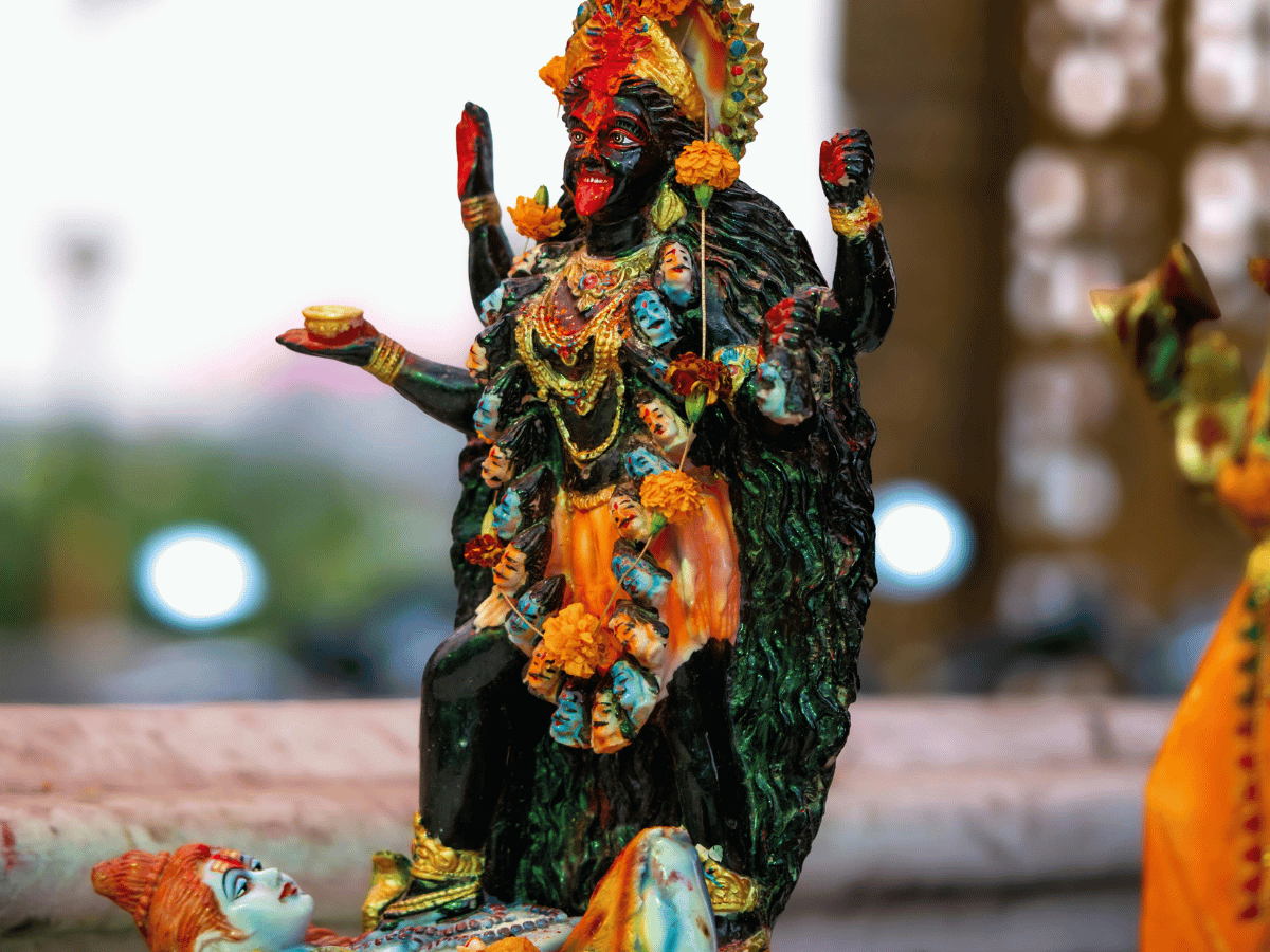 Statue of Kali standing on Shiva.