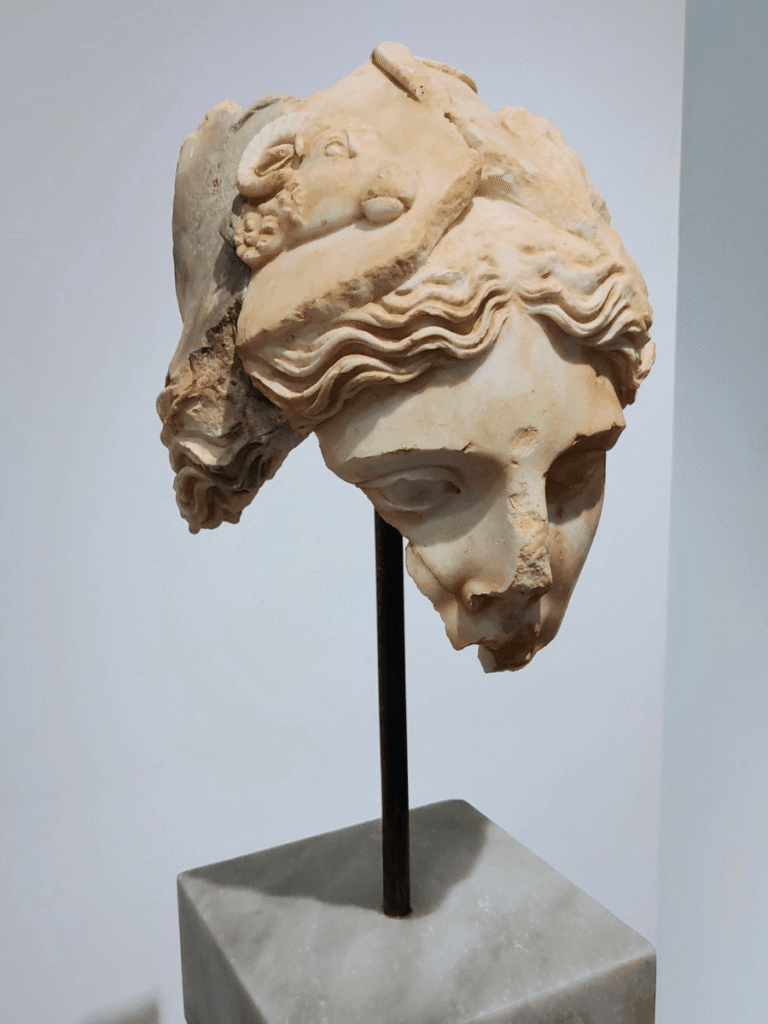 A broken bust of the goddess Athena.