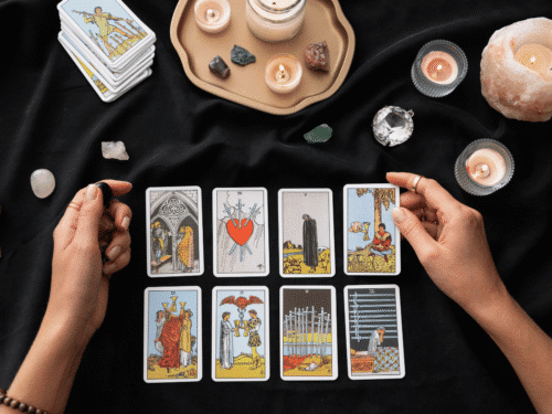 Tarot card reading with candles and crystals