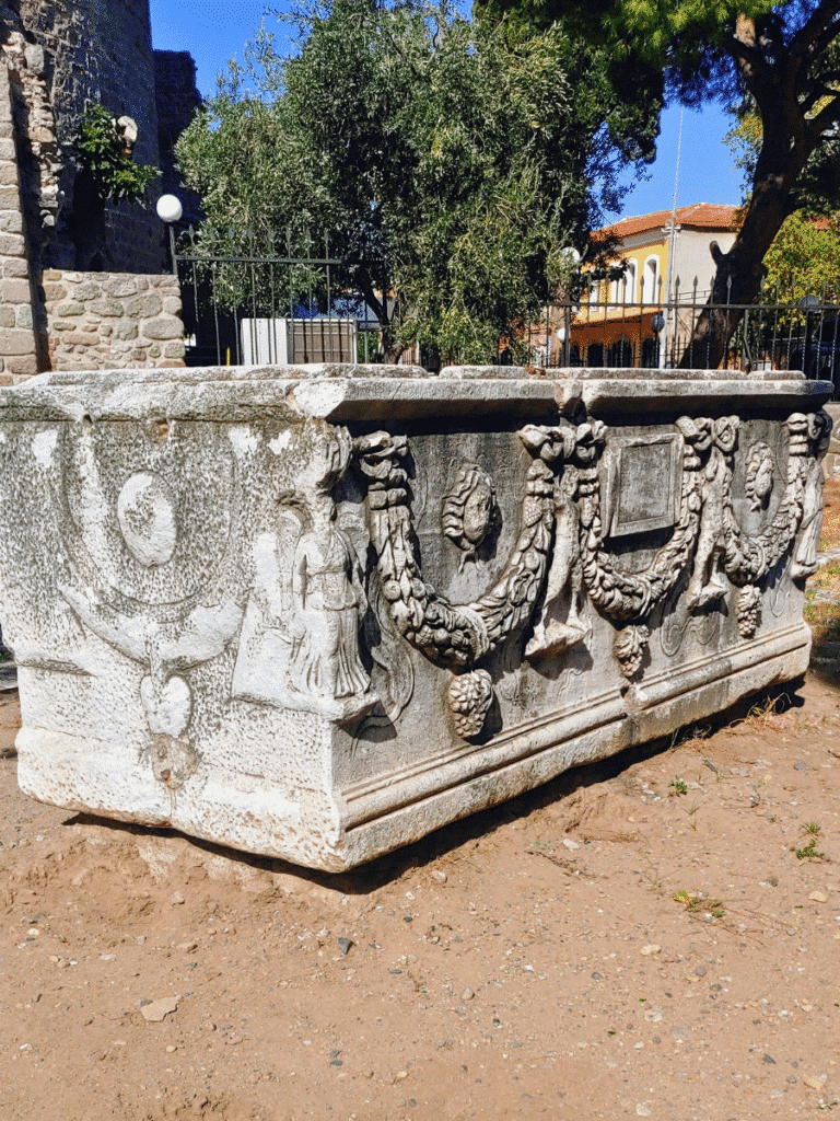 Large marble sarcophagus decorated with carved garlands, figures and animal motifs at the Red Hall.